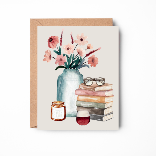 Front of card with a still life painting with a vase of flowers, a pair of glasses atop a stack of books, a lit candle and a glass of wine .