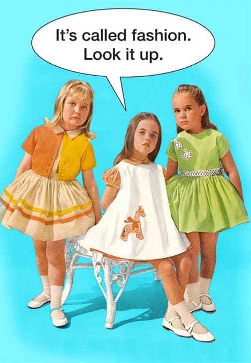 Three young girls, with smug expressions, posing as fashion models in their crisp dresses, socks and white Mary Jane shoes.