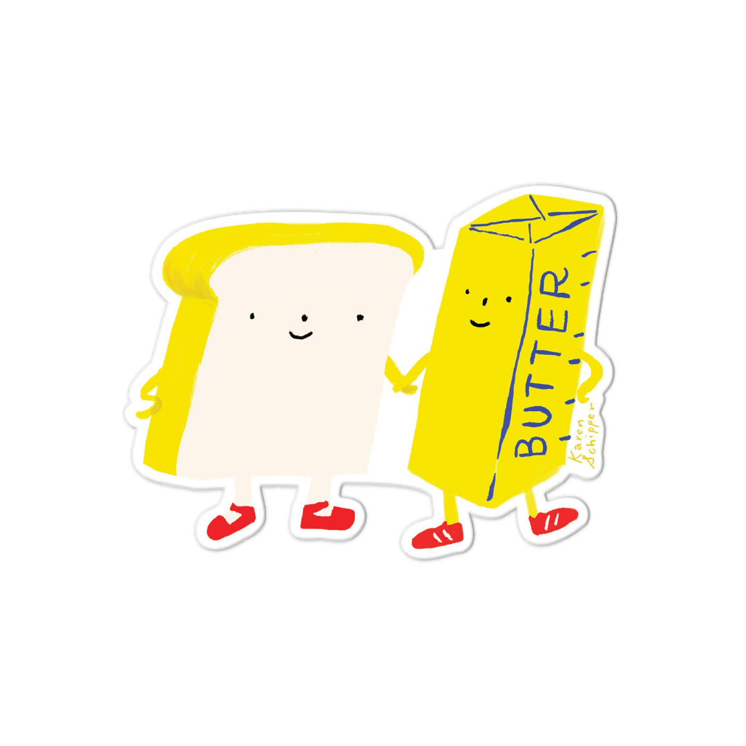A die-cut sticker featuring a cute cartoon illustration of a slice of toast and a butter carton holding hands. The toast is cream-colored with yellow edges, and the butter carton is bright yellow with blue 'BUTTER' text and red shoes.