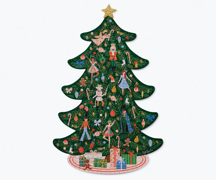 The completed puzzle in the shape of a decorated Christmas tree with a gold star on top and tree skirt with presents at the bottom.