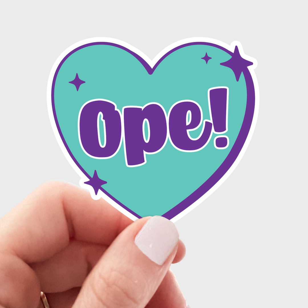 Heart-shaped sticker with teal background and purple outline and stars with the text 'Ope!' in the center. 