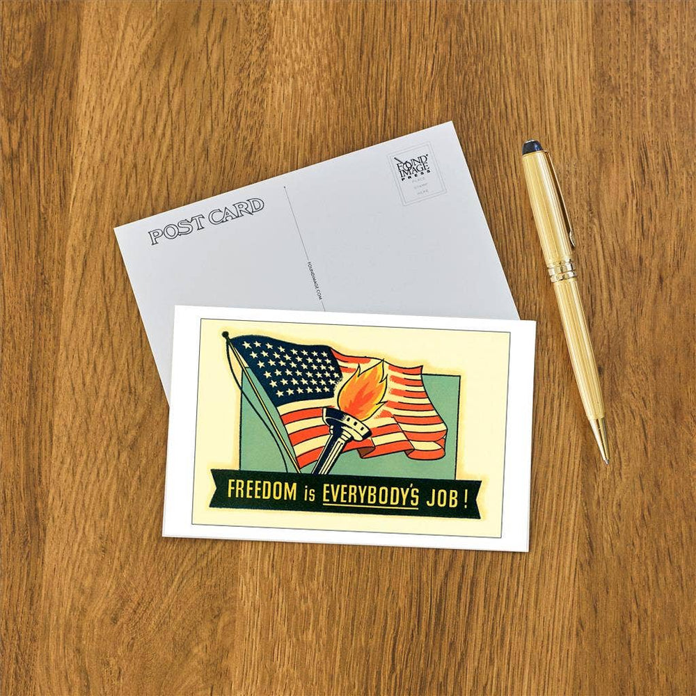 Front and back of postcard next to a pen.