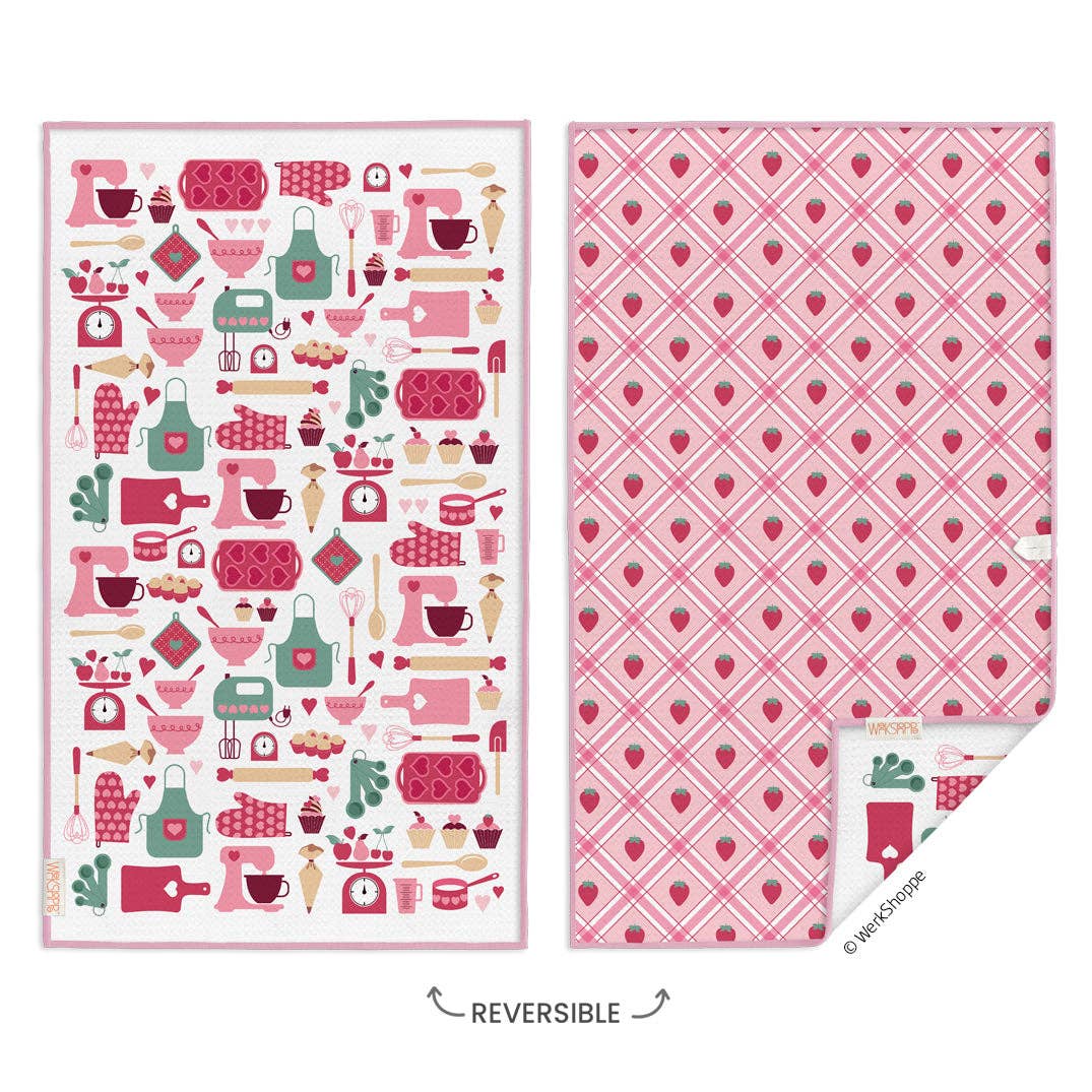 Front and back of the reversible towel. On the left a collage of kitchen items, ranging from hand mixer to apron. On the right a repeated pattern of strawberries.