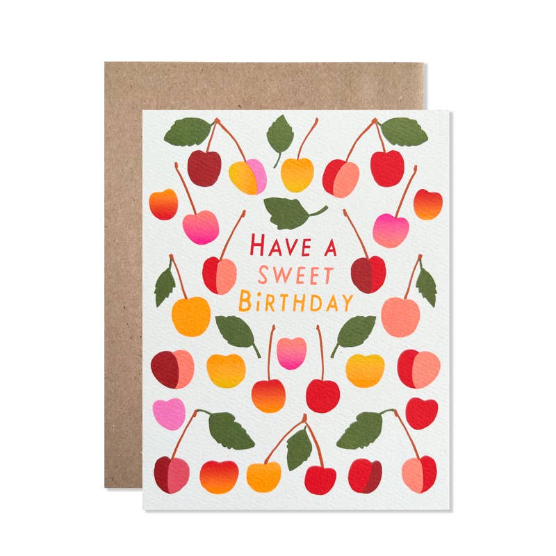 A couple dozen hand-drawn cherries surrounding a hand-lettered greeting.
