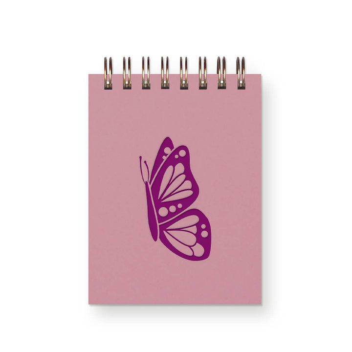 Small spiral-bound notebook with drawing of butterfly in mulberry ink