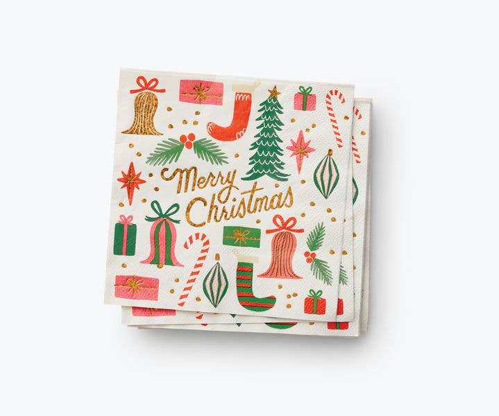 Off-white paper napkins decorated with Christmas images and the text "Merry Christmas."