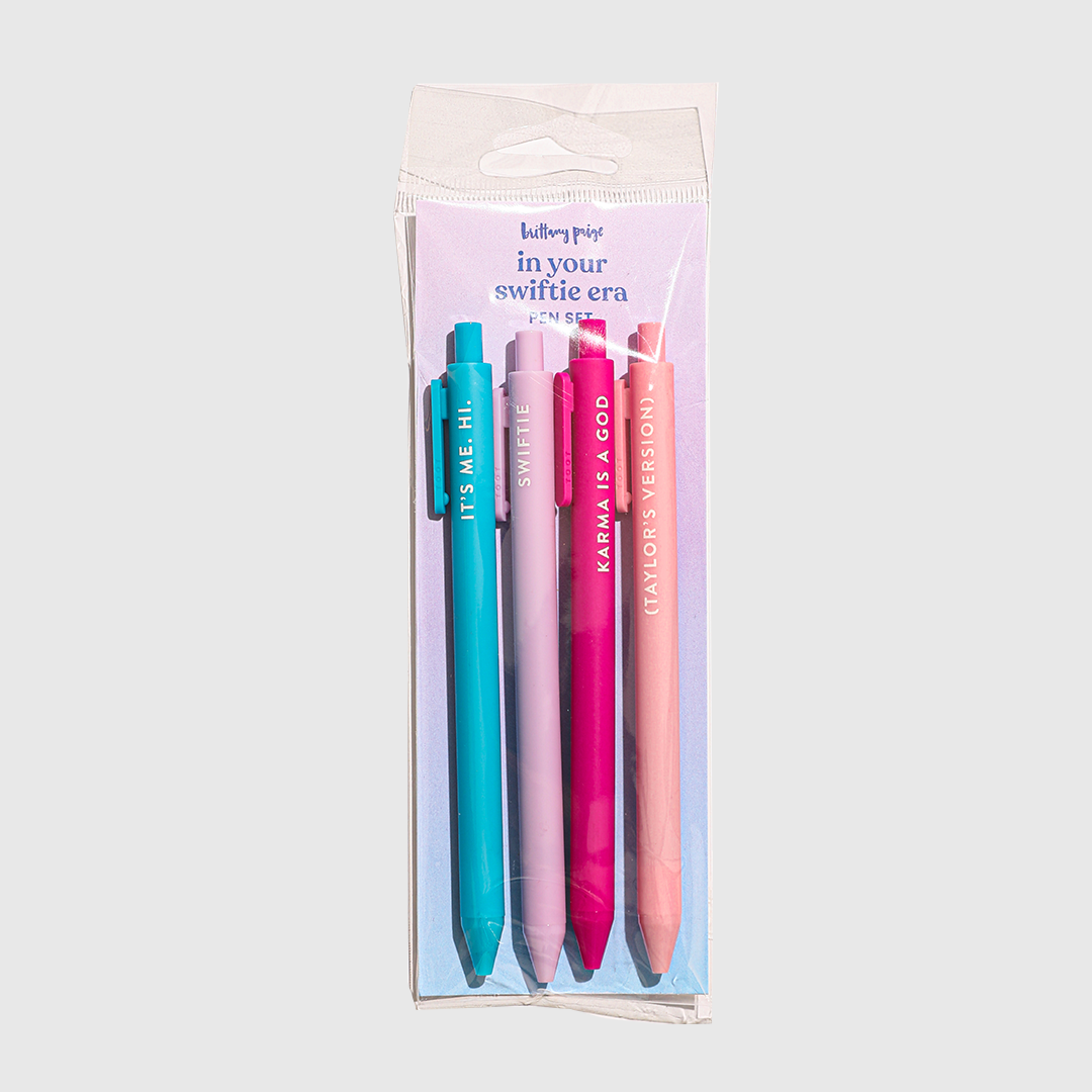 The four pens in their packaging labeled "in your swiftie era pen set."
