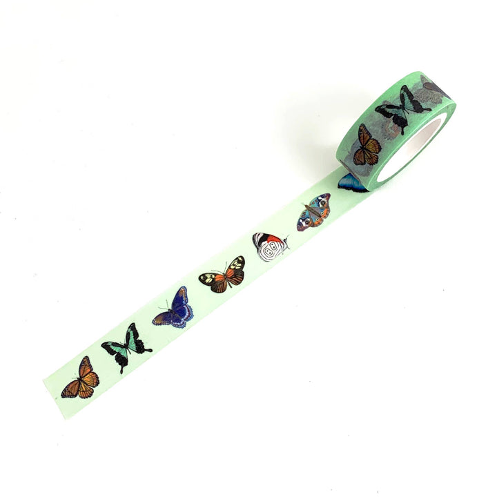Roll of washi tape with butterfly design on a white background