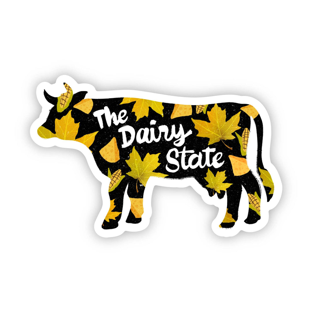 Black cow with yellow leaves and corn and The Dairy State text in a cursive font.