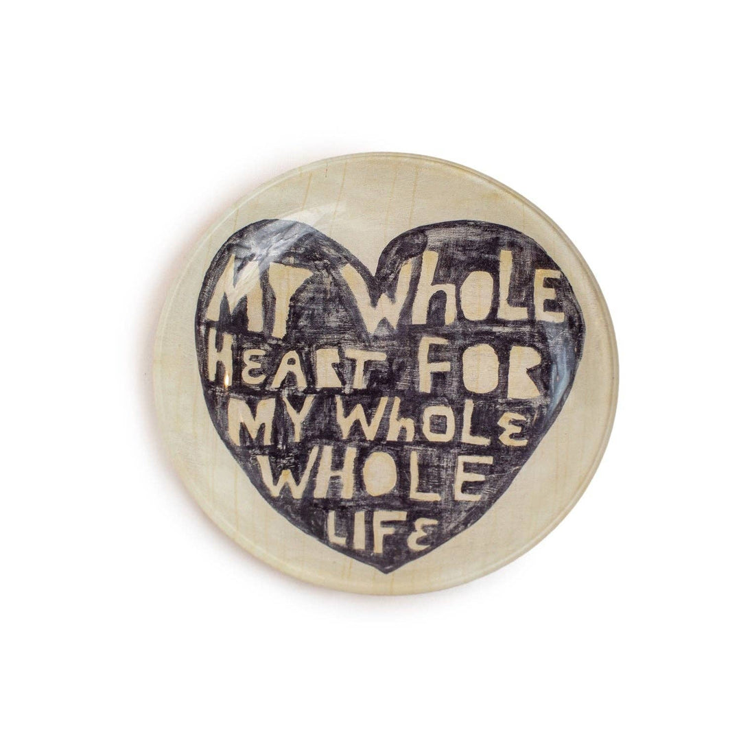 Off-white plate with a black heart with off-white hand-drawn text 'My whole heart for my whole life.'