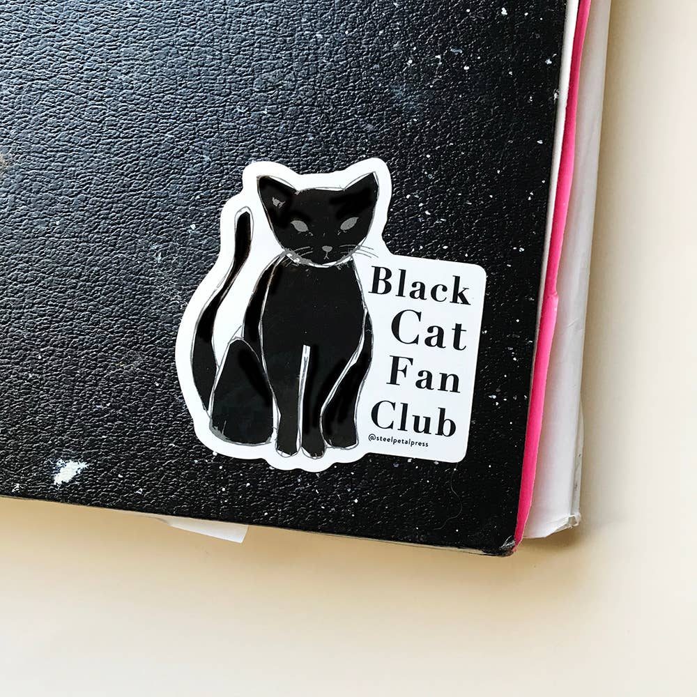 Black cat with long tail and text on the right side.