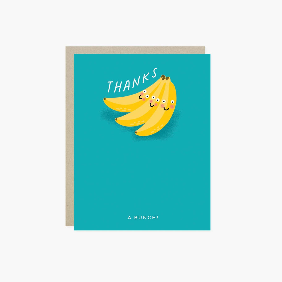 Front of greeting card with cartoon bananas and 'THANKS' text on a teal background.