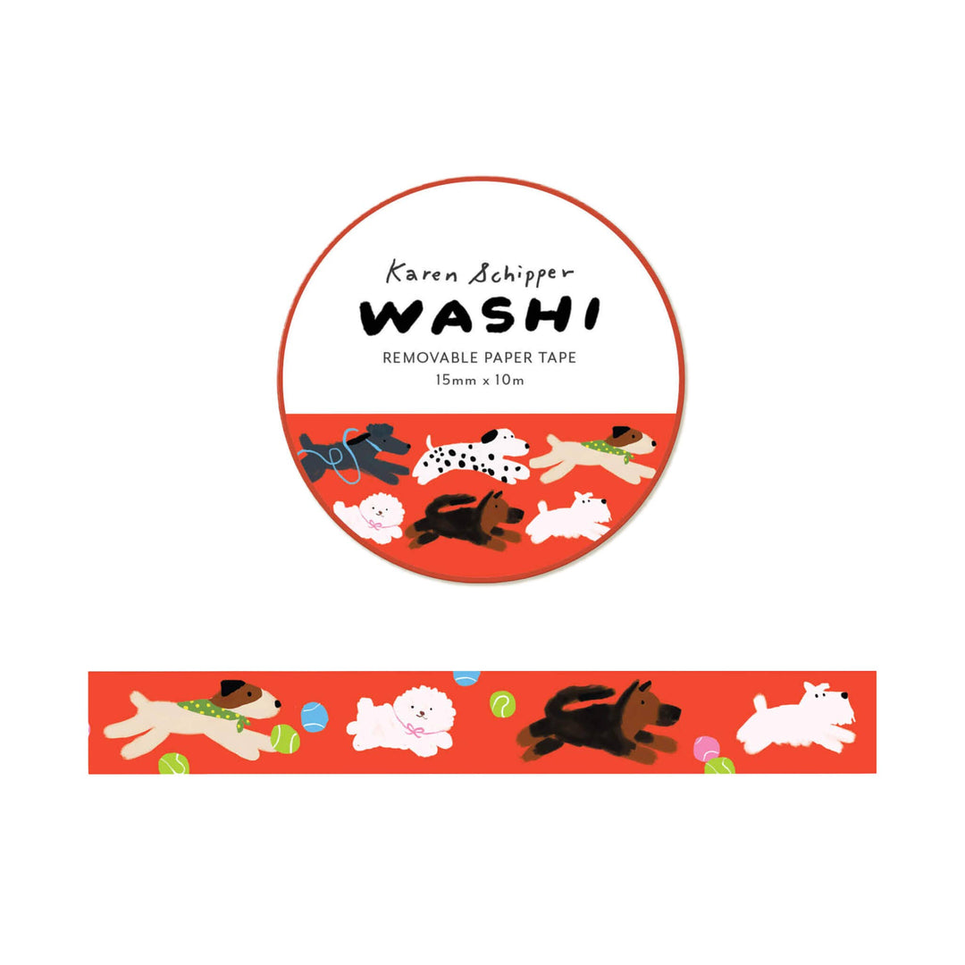 A roll of Karen Schipper Washi removable paper tape with a red background and cartoon dog illustrations, shown alongside a straight strip of the tape displaying the dog pattern.
