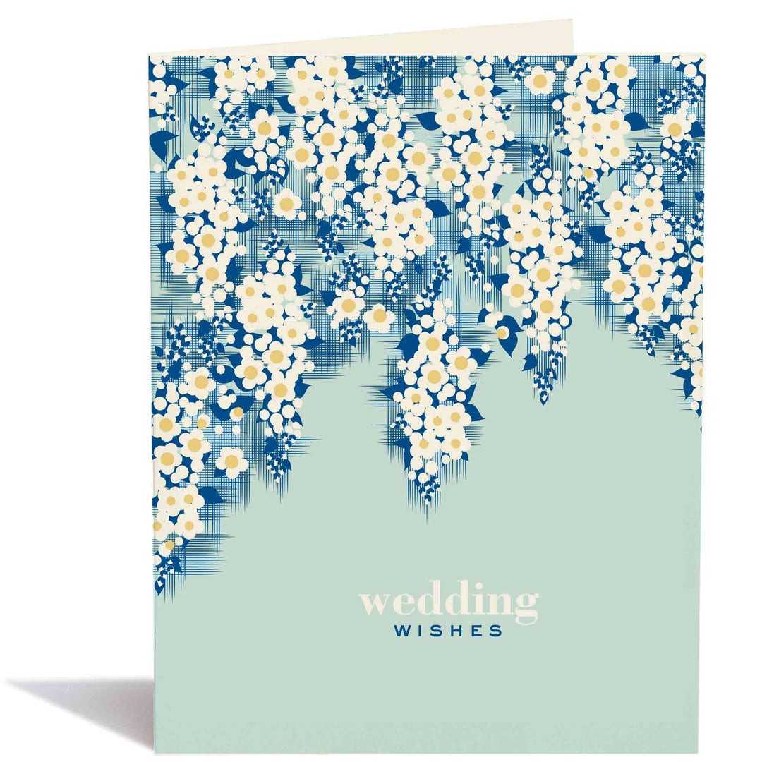 White anemones spill down from the top of the card forming a bower above the text.