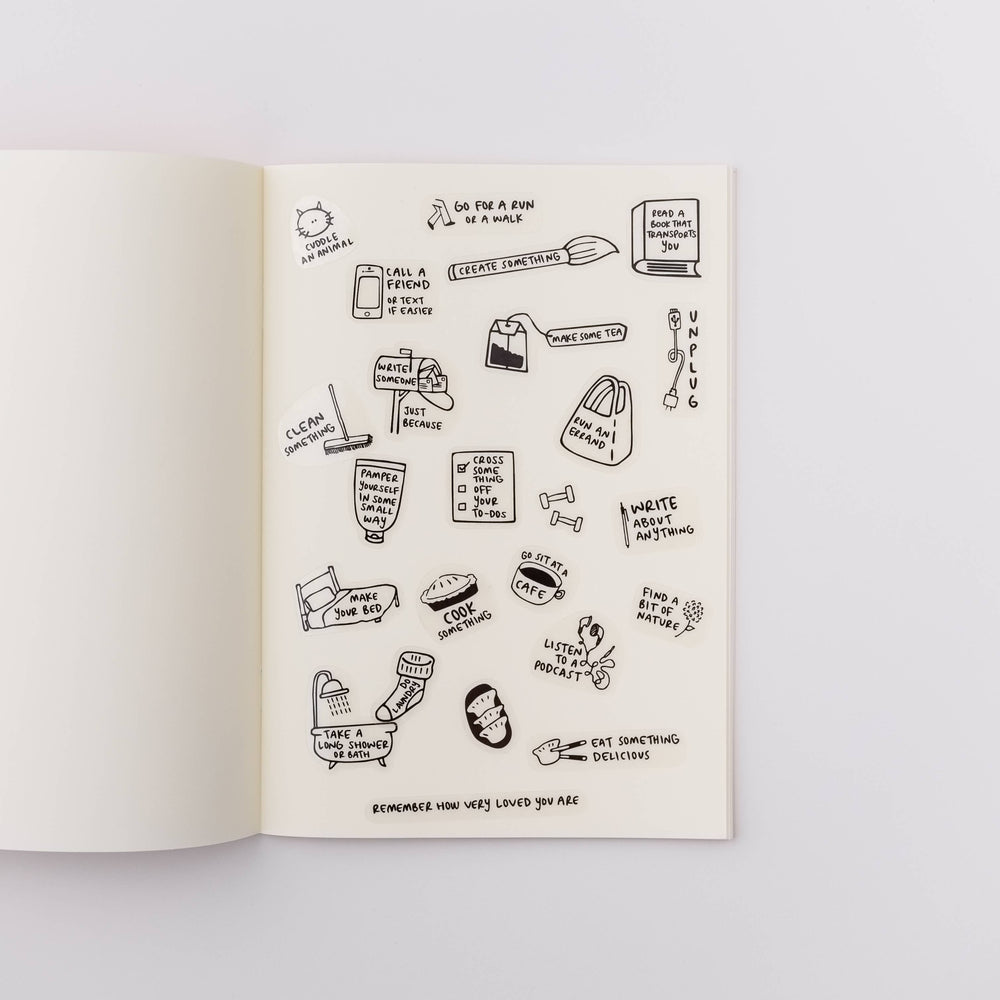 Open book with stickers on a page. 