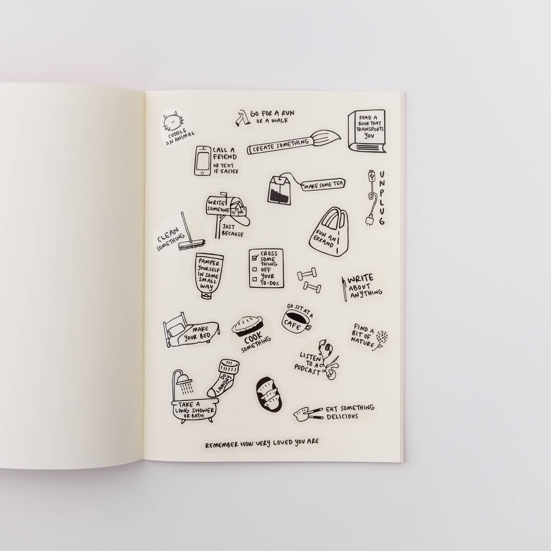 Open book with stickers on a page. 