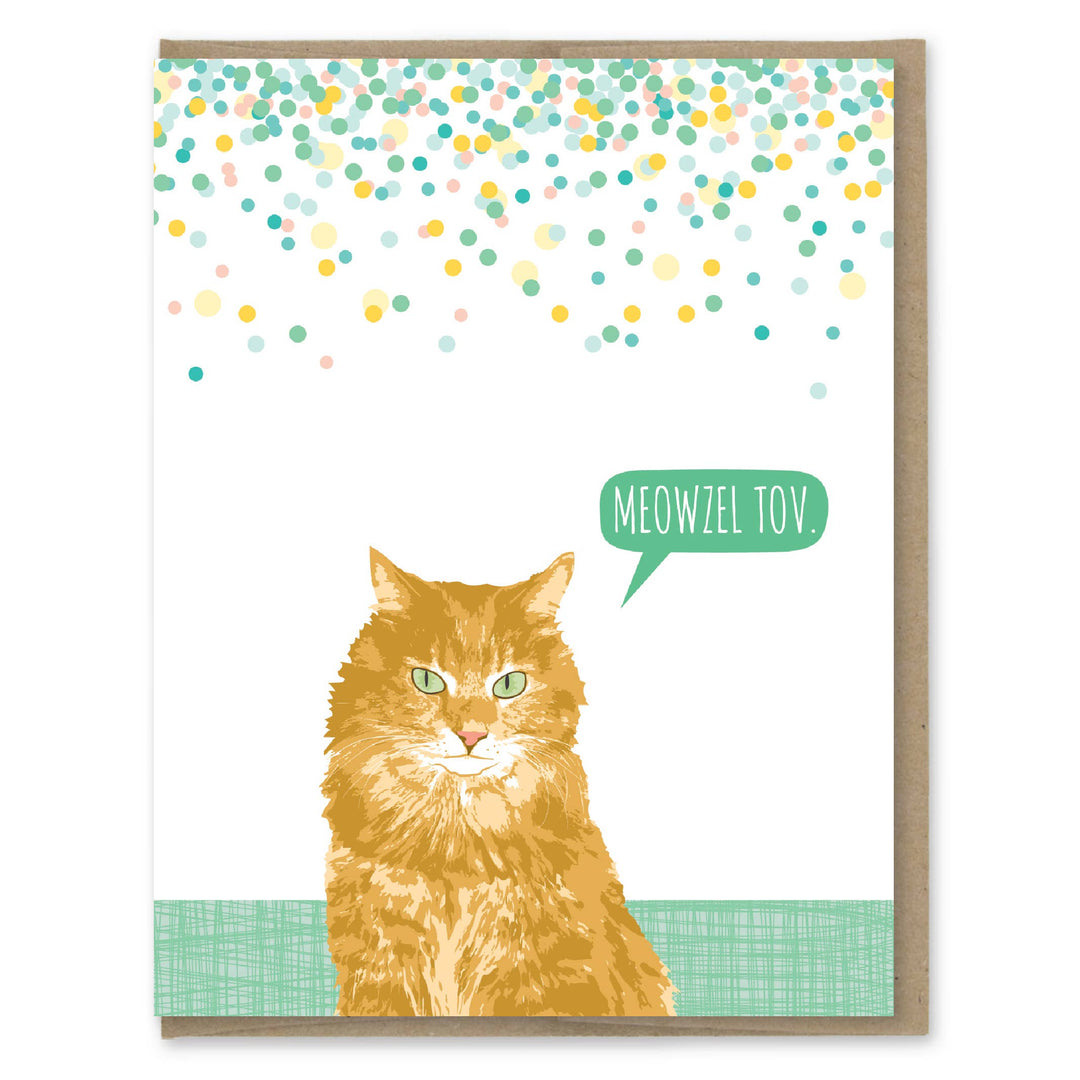 Front of card with an illustration of a yellow cat with green eyes saying 'Meowzel Tov' with green and yellow confetti falling from the top of the card.
