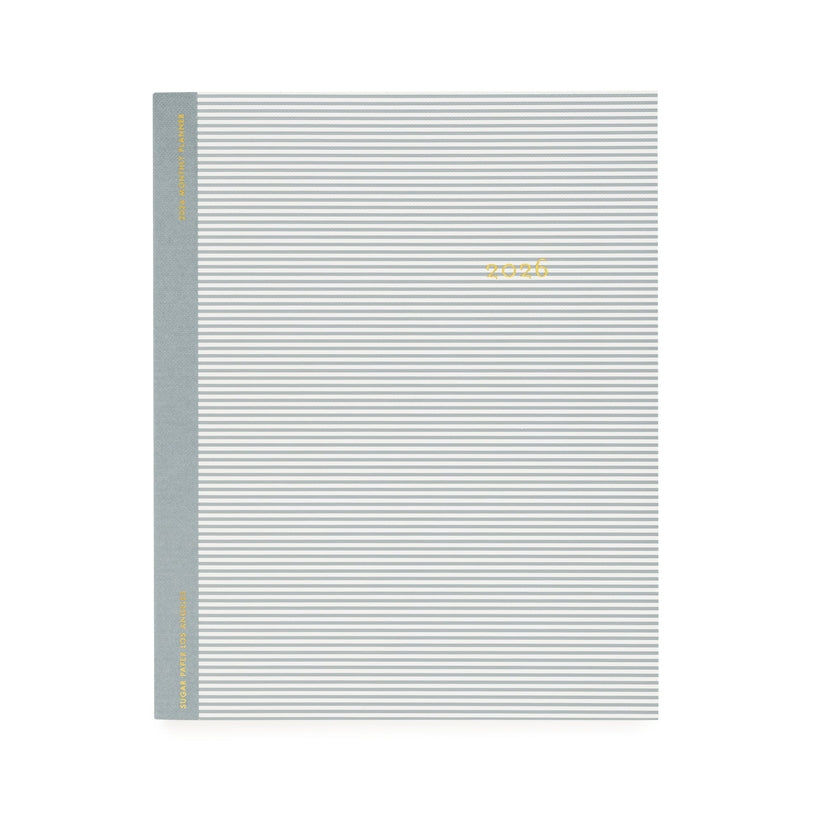 Gray and white striped notebook cover with a gold "2026" 