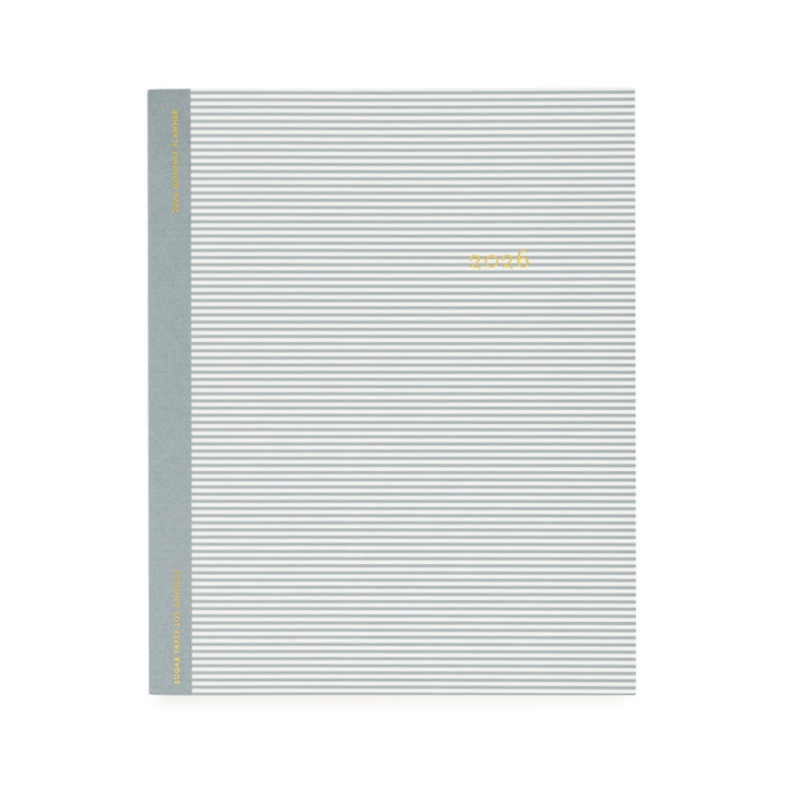 Gray and white striped notebook cover with a gold "2026" 