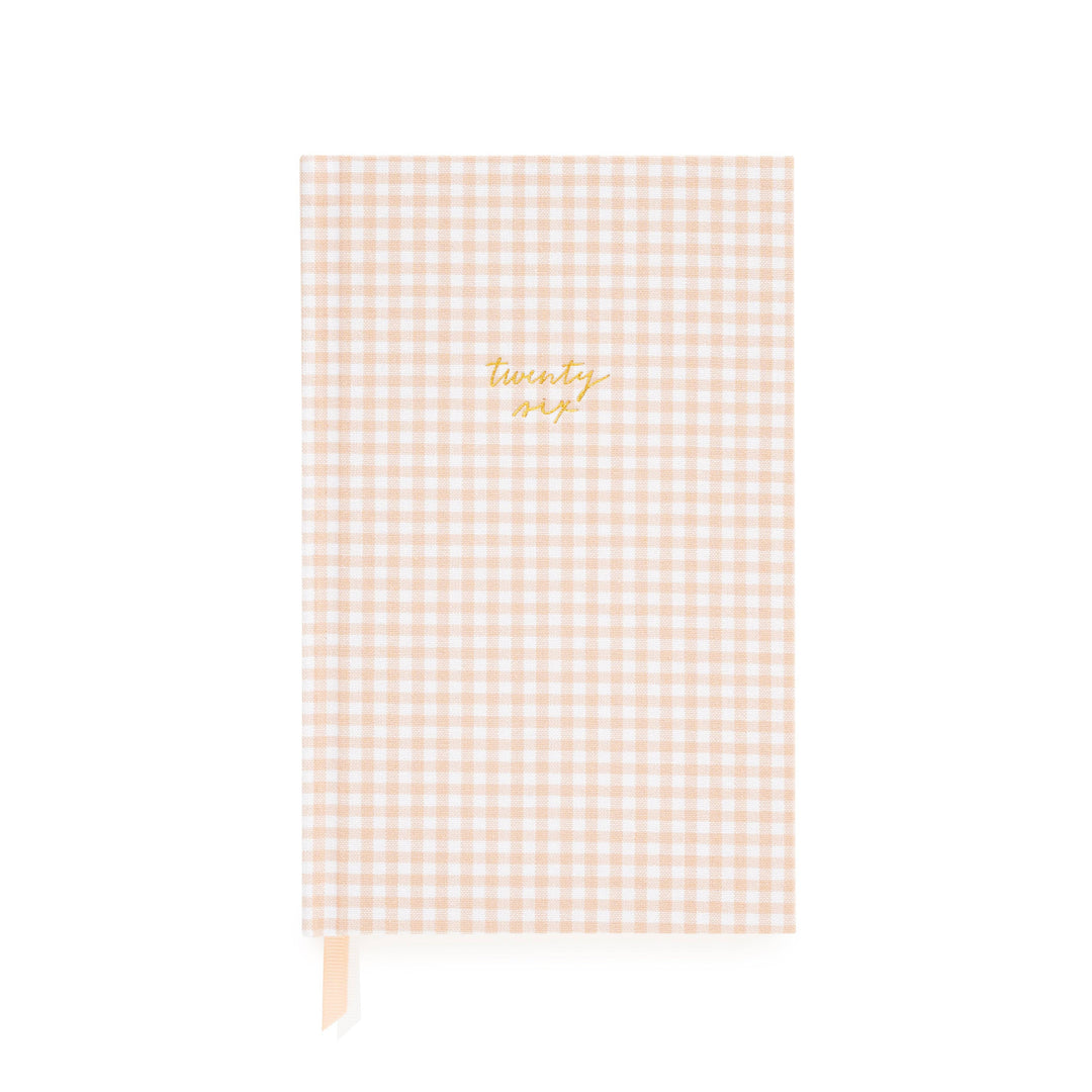 Pink gingham notebook with 'twenty six' in gold