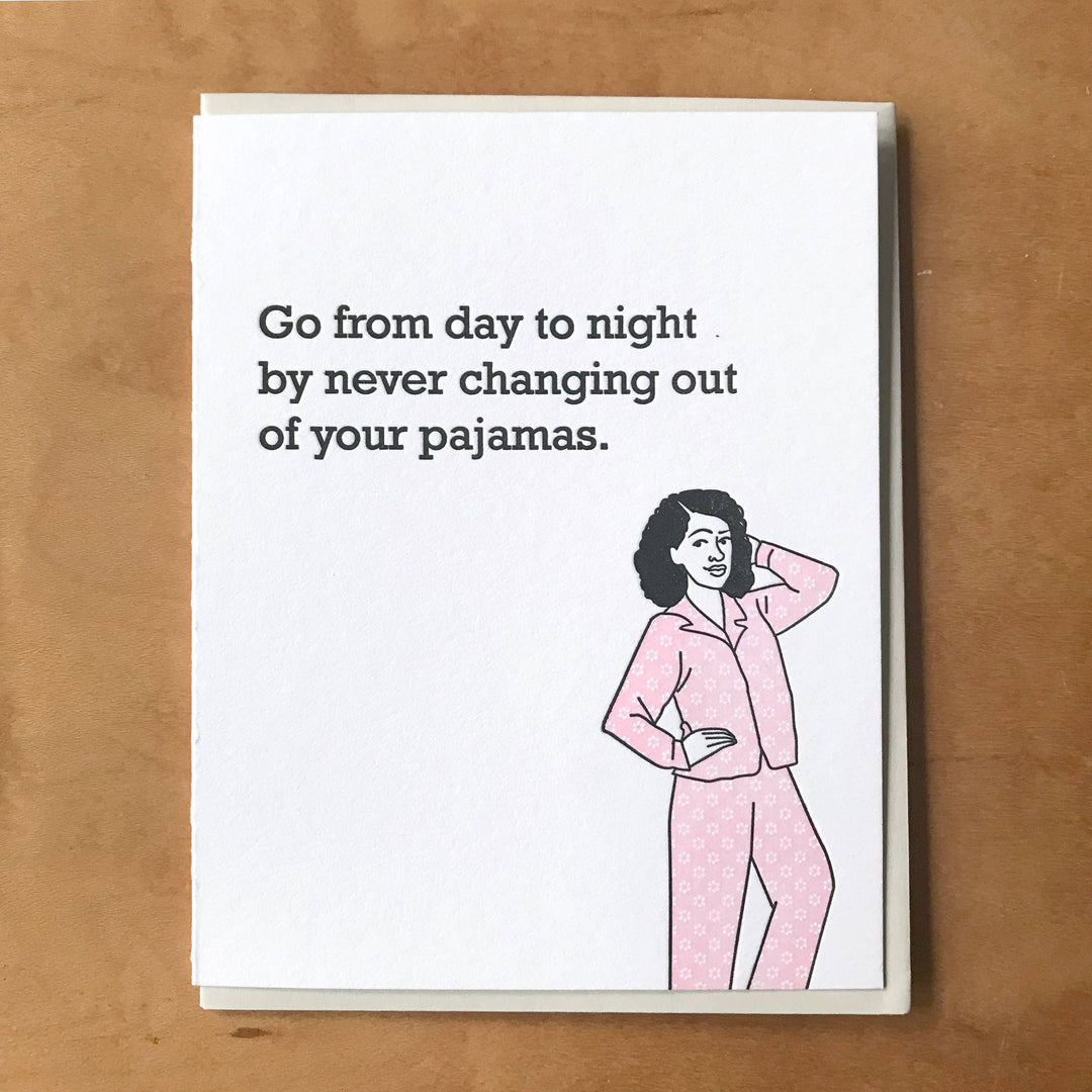 Front of card with an illustration of a person in pink pajamas.