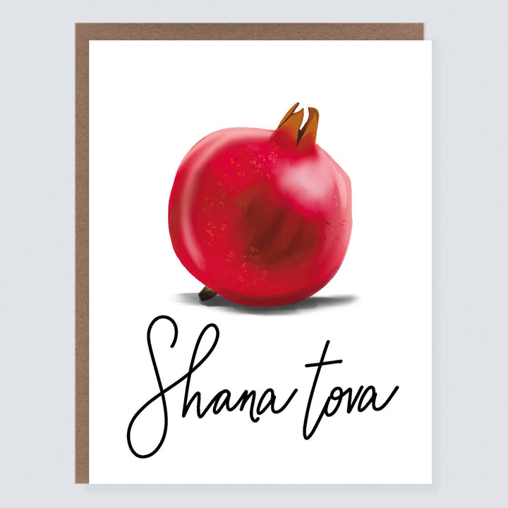 Red pomegranate and 'Shana Tova' text 