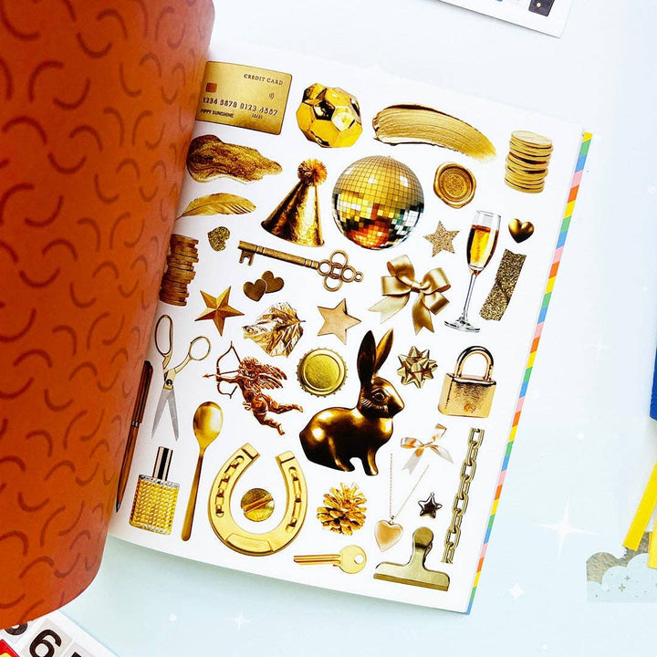 Page of various objects in gold, including a key, a horseshoe and a spoon.