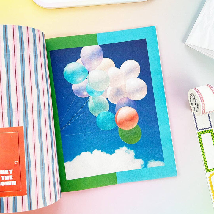 Sample page from sticker book with helium balloons floating above the clouds on a blue sky.