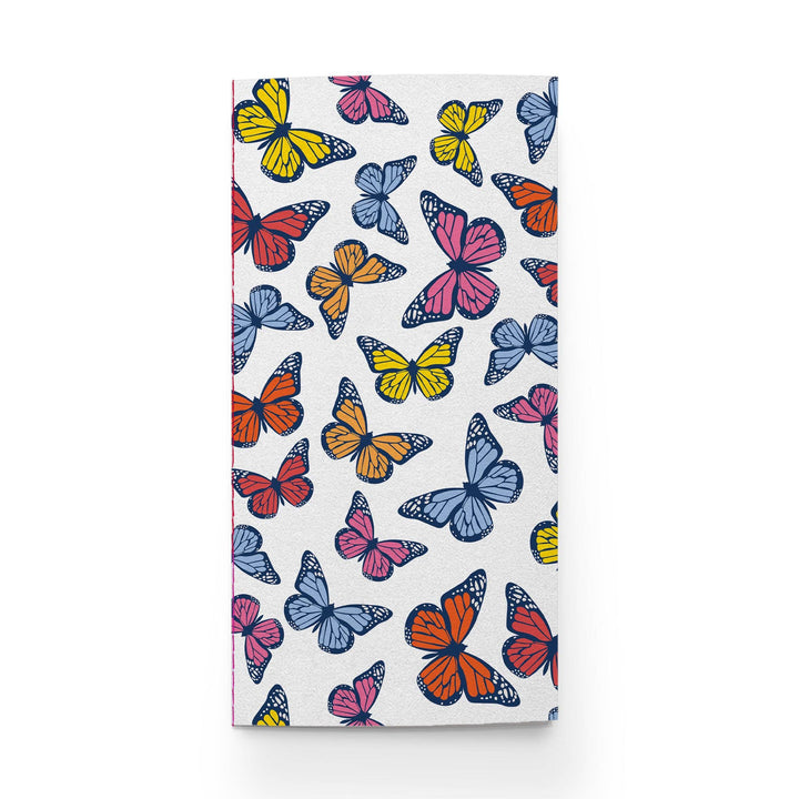Cover of notebook with colorful butterfly pattern.