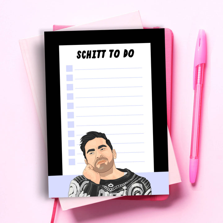 Purple lines with checkboxes under the heading "Schitt To Do" and a drawing of the character David Rose at the bottom of the page.