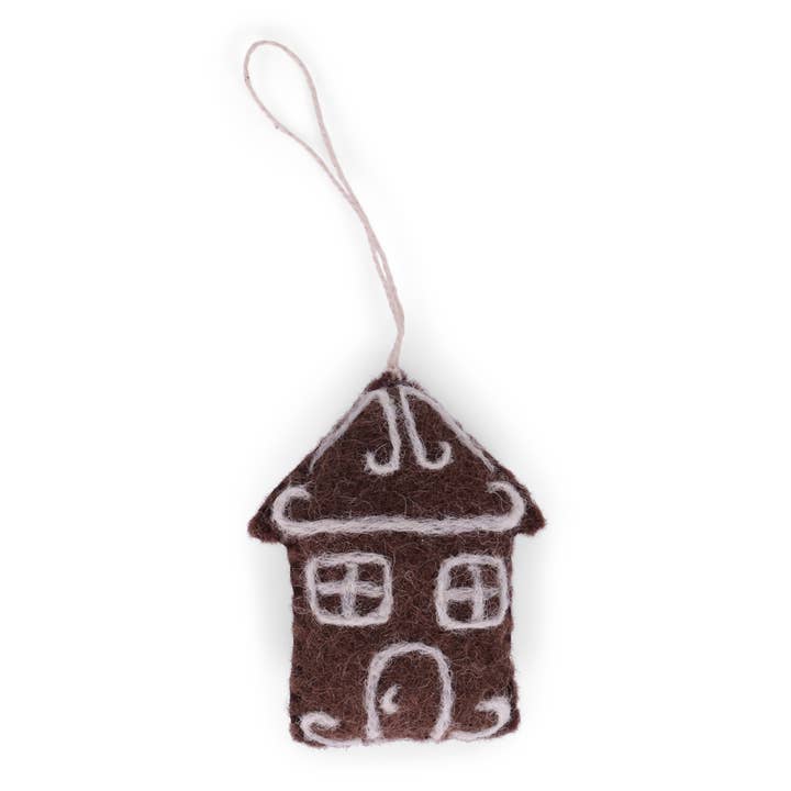 Brown gingerbread house with door and windows outlined in white.