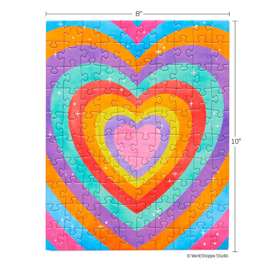 Completed puzzle of concentric hearts in bright colors. Shows measurement of 8" x 10".