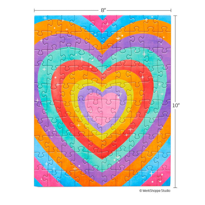 Completed puzzle of concentric hearts in bright colors. Shows measurement of 8" x 10".