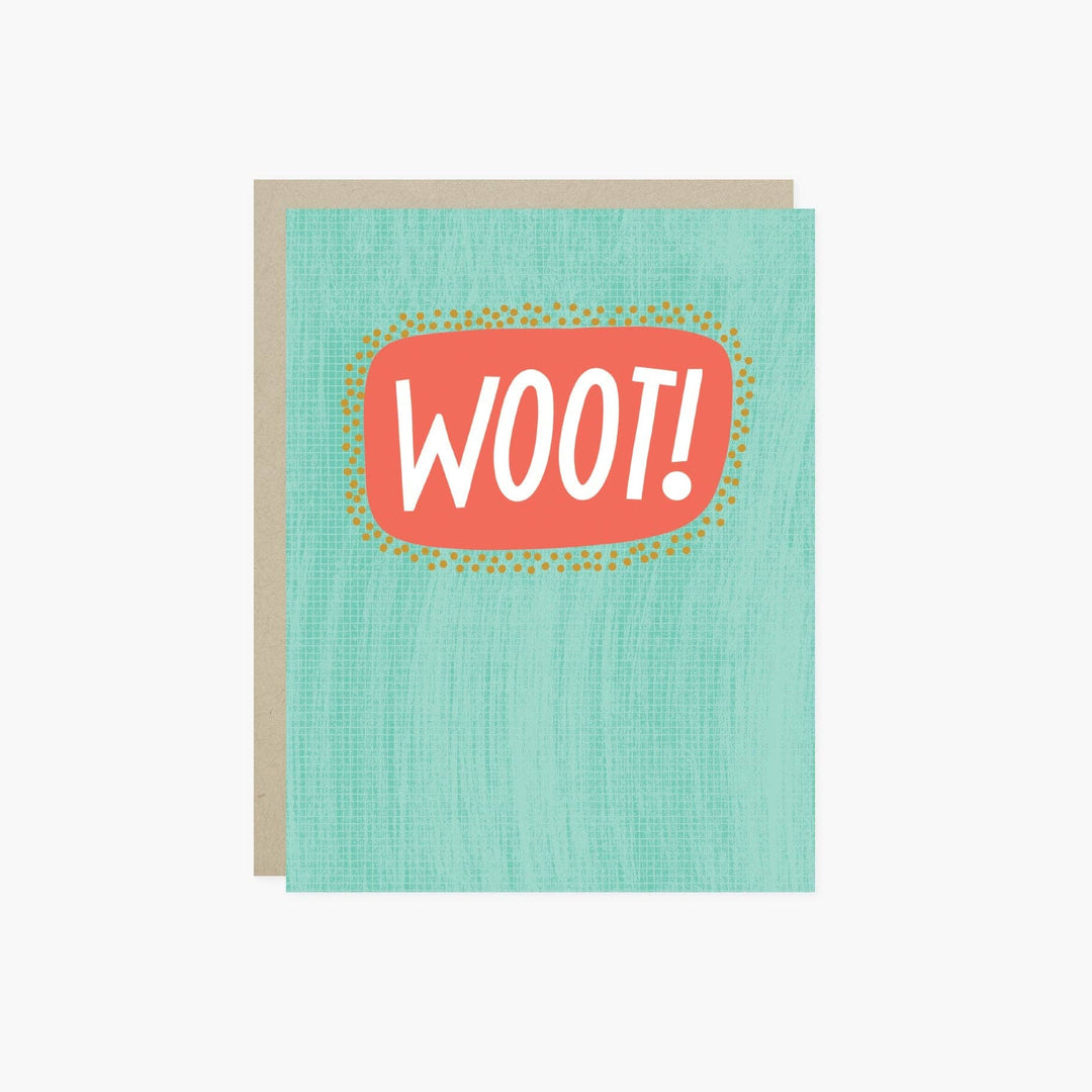 A greeting card with a textured mint green front and a kraft paper envelope behind it. The card features a coral-red speech-bubble graphic with the word 'WOOT!' in white, surrounded by small yellow dots.
