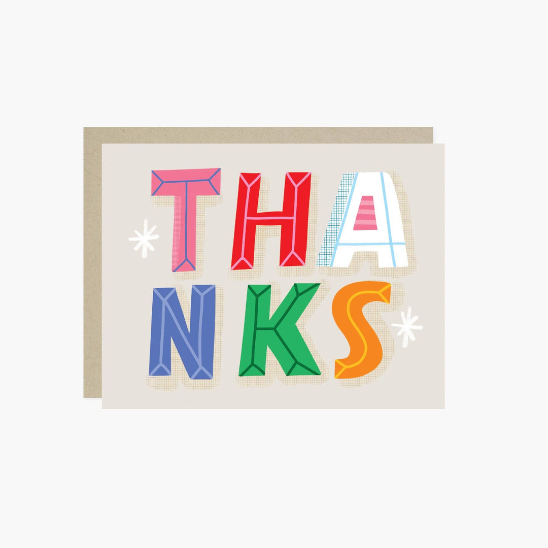 Front of card with colorful block letters spelling 'THANKS' on a light tan background
