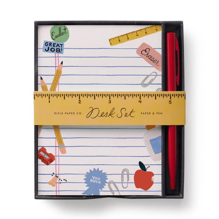 Package of notes with a red pen. The pages of the notepaper are lined and decorated with school-related objects.