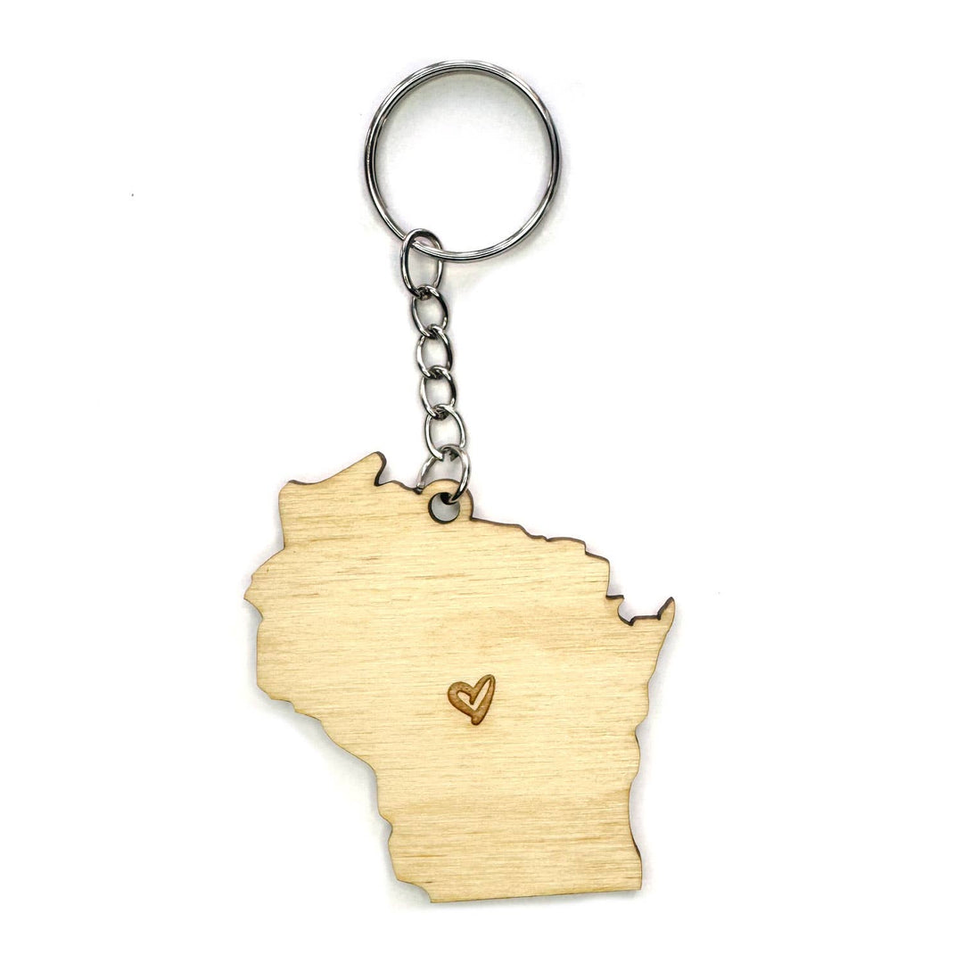 A wooden keychain shaped like the state of Wisconsin, featuring a natural light wood finish with a small engraved heart and a silver metal key ring and chain.