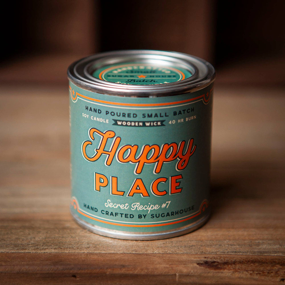 Soy candle in tin. Turquoise label with orange lettering. Label is Happy Place secret recipe #7..