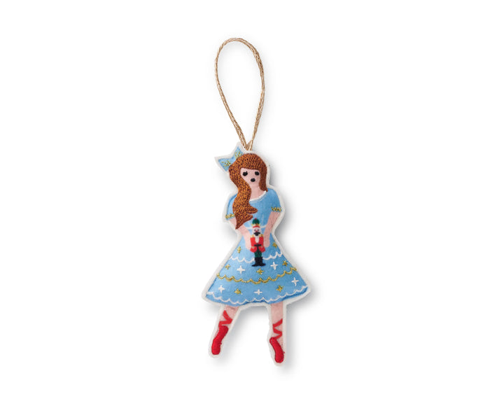 Dancing Clara wearing a blue hair ribbon, blue dress with white and gold accents, and red toe shoes, holding a prince, and with a gold hanging string.