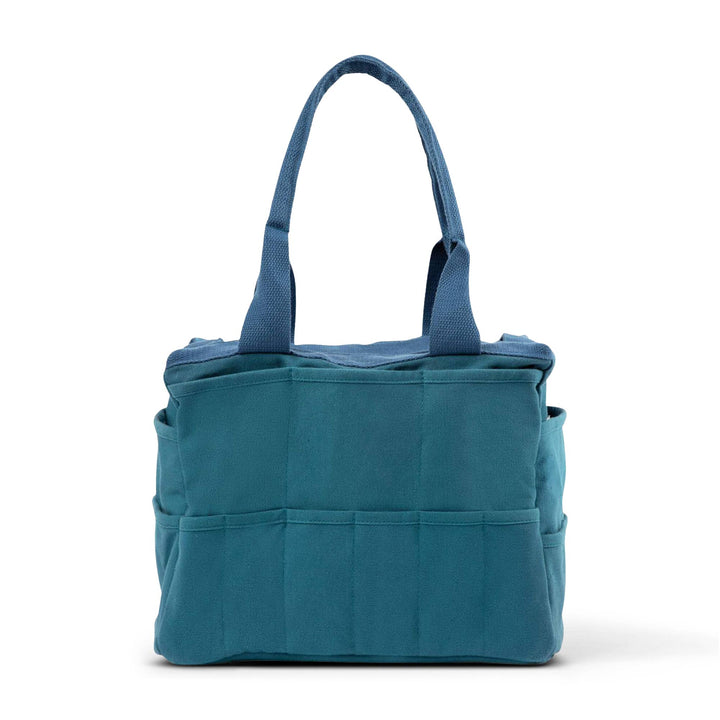 Back side of bag (shown here in aquamarine) with six medium width pockets .