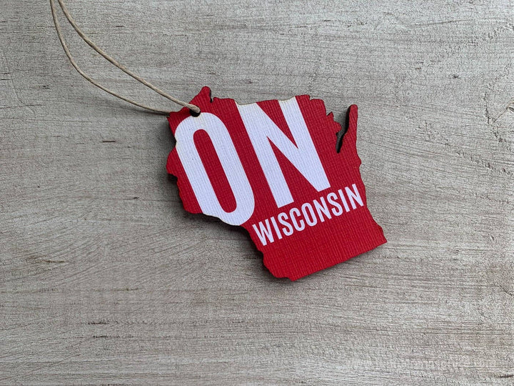 Red ornament shaped like Wisconsin with 'ON WISCONSIN' text  in white.
