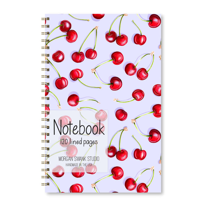 Notebook with cherry pattern on a white background