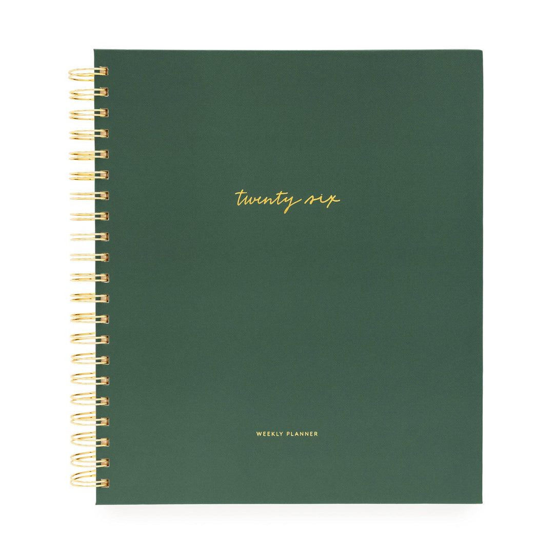 Cover of green planner with gold text 'twenty-six' and spiral binding on the left side. 