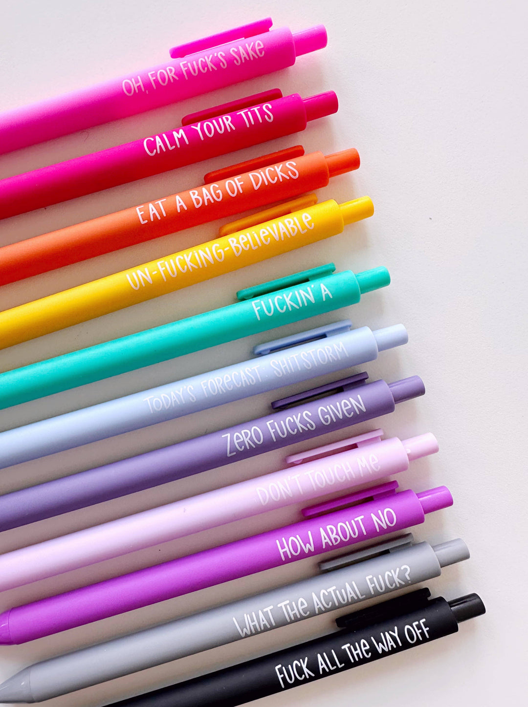 Colorful pens with various text designs 