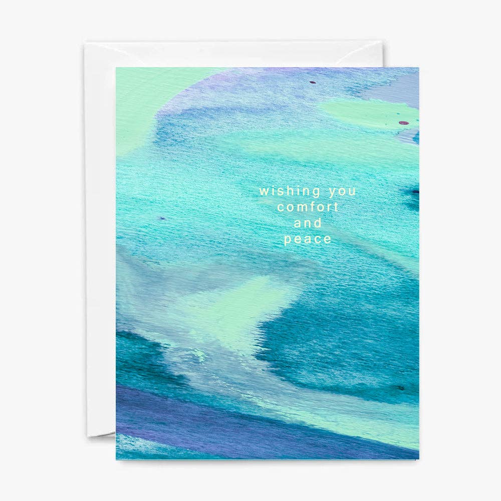 Front of sympathy card with abstract blue and green design and text 'Wishing you comfort and peace'