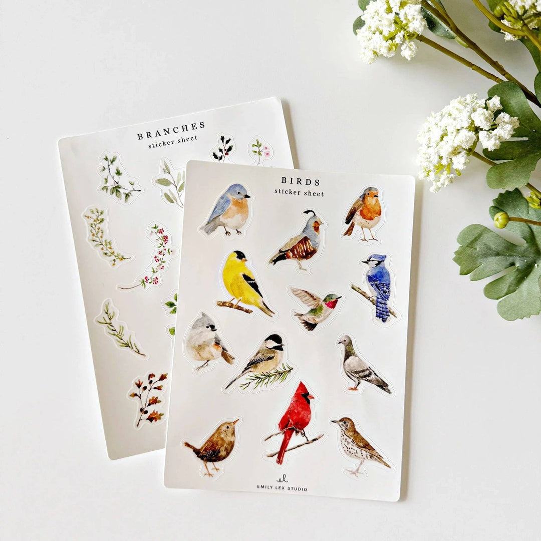 Two sticker sheets with 10 watercolor images on each sheet. One sheet is of a dozen birds; the other sheet of flowering branches.