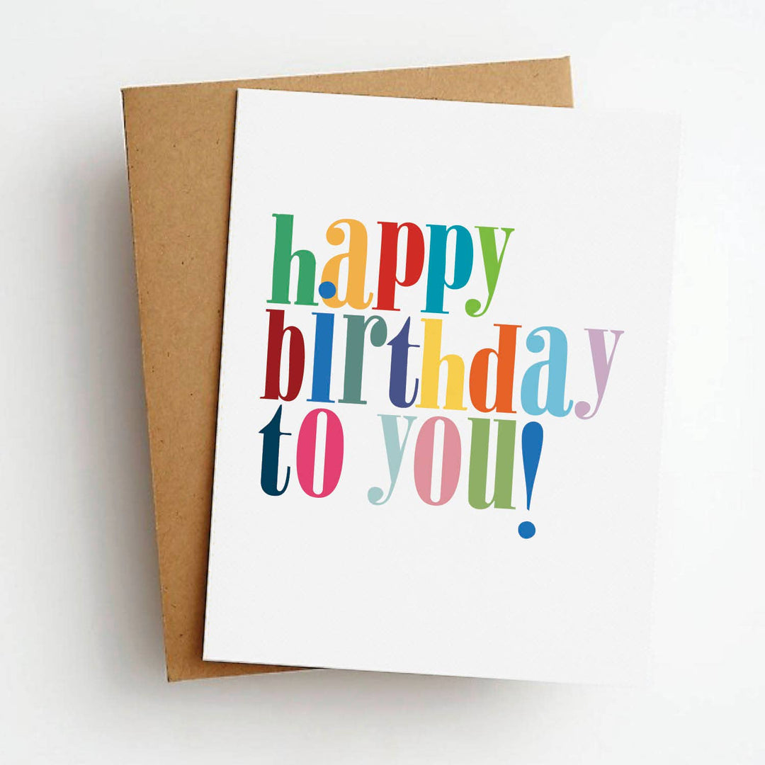 Front of birthday card with colorful 'Happy Birthday to You!' text a white background.