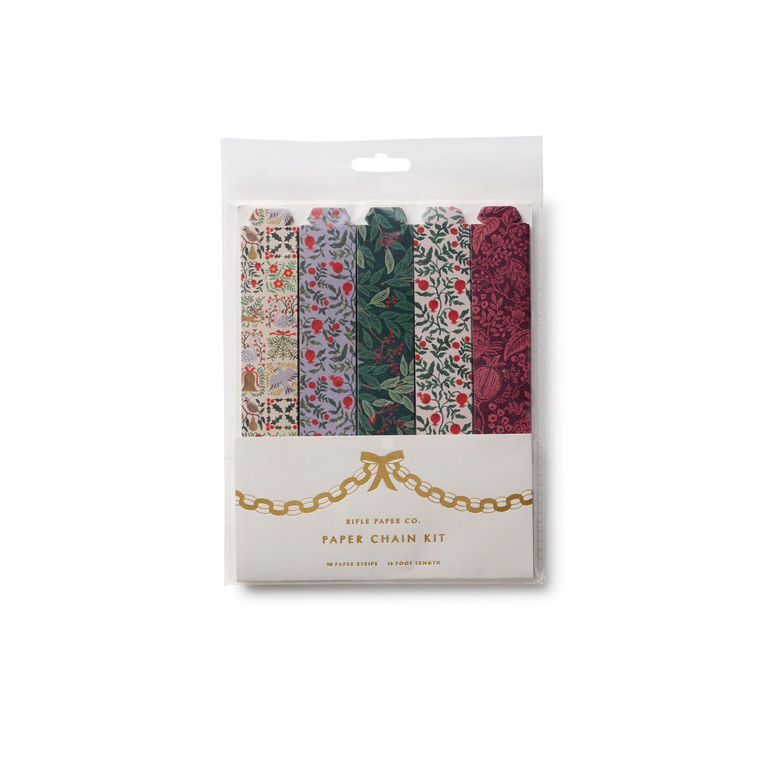 A packaged paper chain kit by Rifle Paper Co. in a clear plastic sleeve with a white lower label featuring gold chain artwork.