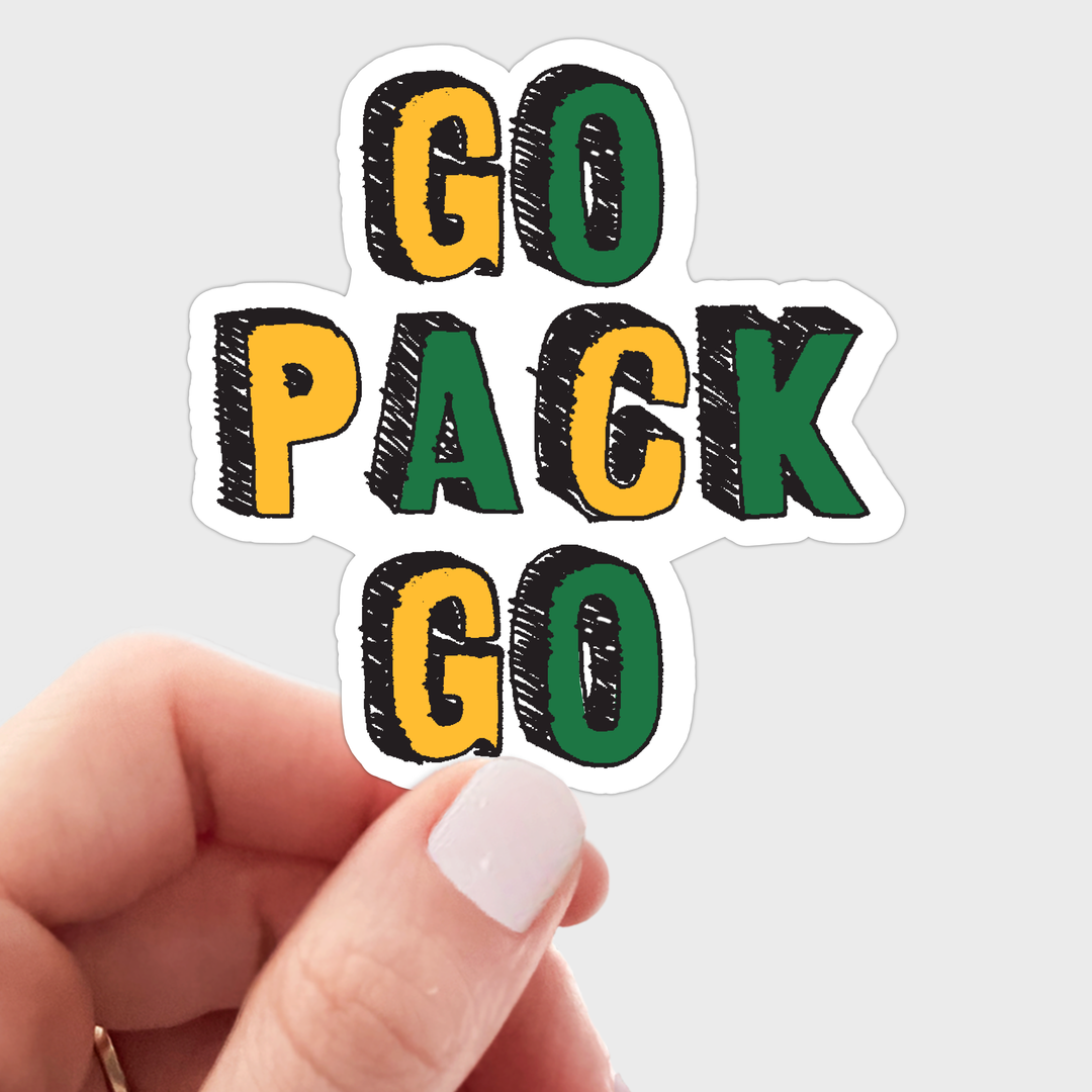 A hand holds a three-line die-cut sticker that reads 'GO PACK GO' in bold yellow, green, and black letters with a white outline.
