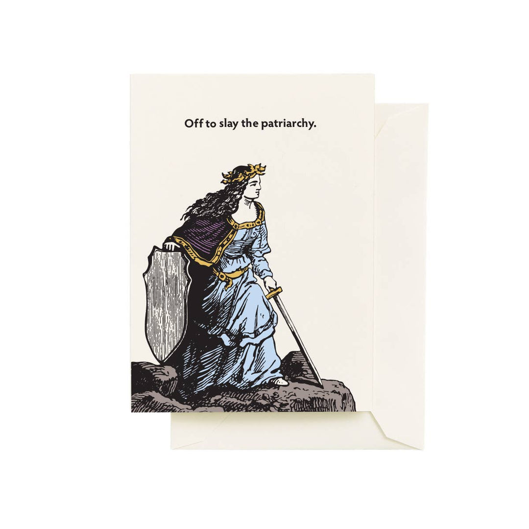Front of card with a drawing of a woman holding a sword and shield, with text 'Off to slay the patriarchy.'